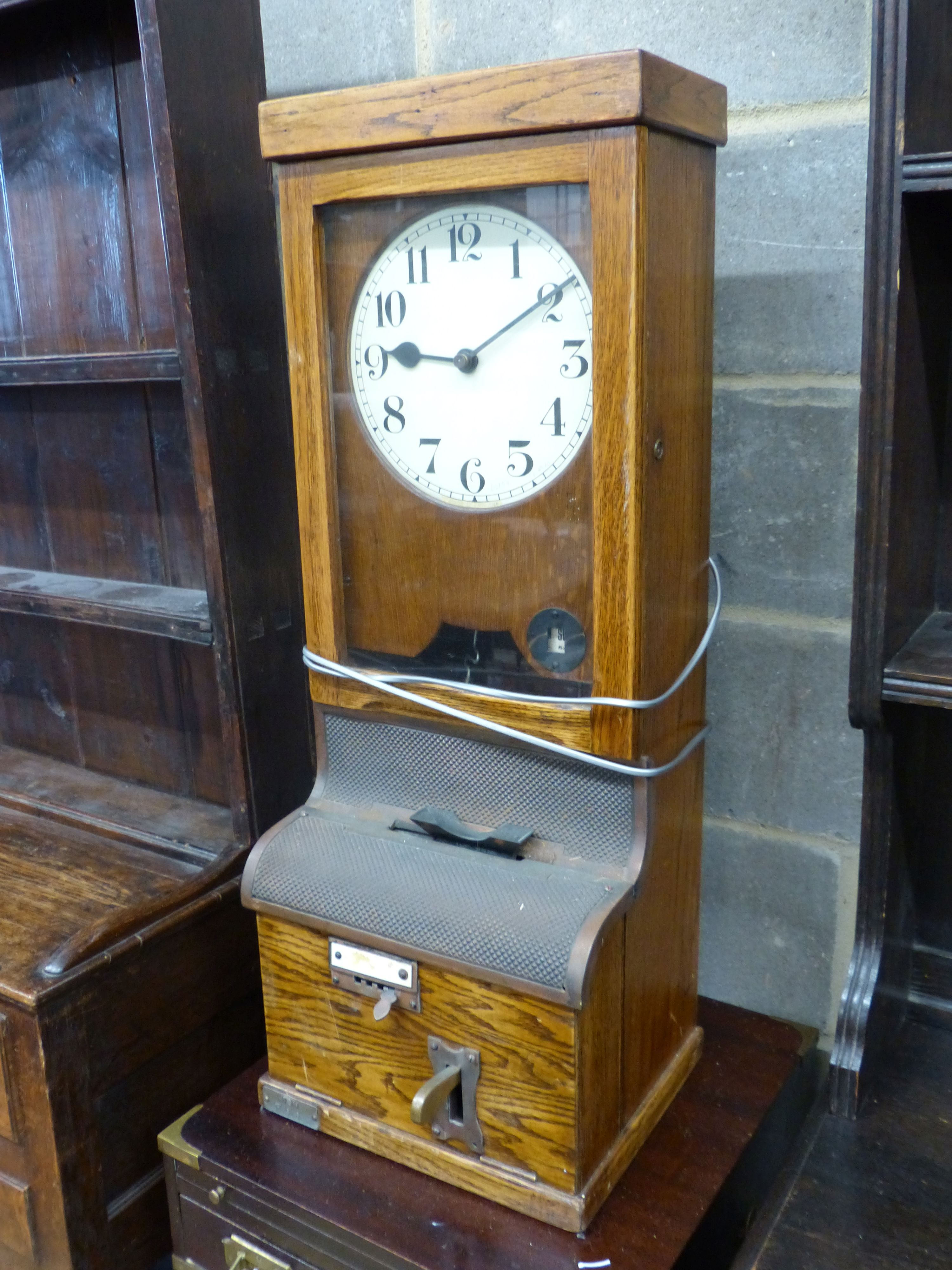 A vintage oak-cased electric wall factory time recorder clock, circa 1930